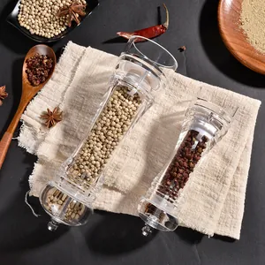 Premium clear acrylic spice grinders with ceramic core on a rustic linen cloth background