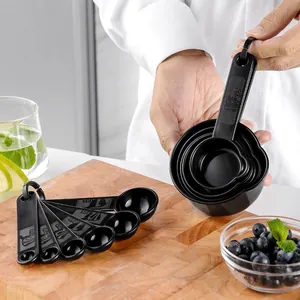 11-piece black plastic measuring cups and spoons set for professional baking and kitchen cooking