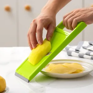 Handheld green multifunctional vegetable slicer for potato cucumber slices in kitchen