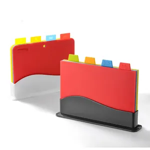 Color-coded 4-piece PP plastic cutting board set with storage stand for kitchen use