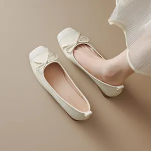Elegant French style cream ballet flats with dainty bow detail and square toe design