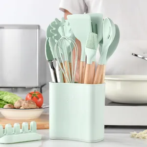 12-piece mint green silicone kitchen utensil set with wooden handles and storage holder