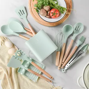 Complete 12-piece mint green silicone kitchen utensil set with ergonomic wooden handles