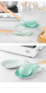 Detailed view of mint green silicone spoon rests in a modern kitchen setting