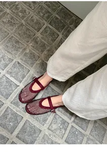 Elegant burgundy mesh Mary Jane flats featuring sparkling rhinestone details and buckle strap