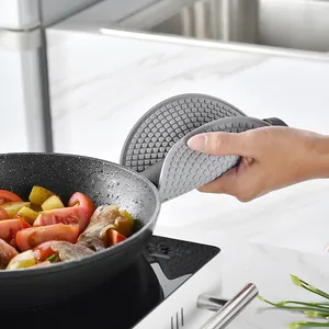 Round grey silicone heat resistant pot holder mat for kitchen handling hot frying pans
