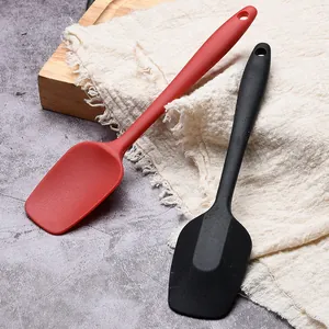 Set of small red and black food-grade silicone cake spatulas for baking
