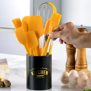 8-piece yellow silicone kitchen utensil set with spatulas, whisk, and storage holder