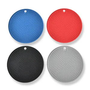 Set of 4 round silicone heat resistant mats in blue red black and grey for kitchen