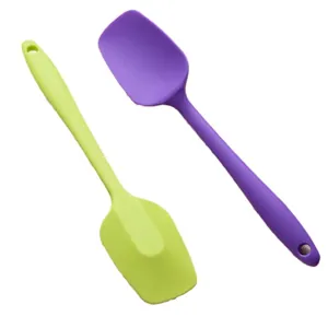 Two food-grade silicone spatulas in lime green and purple for baking and cooking