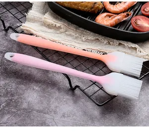 Detail view of two semi-transparent silicone basting brushes for BBQ and cooking.