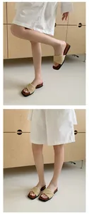 Detail view of woven wedge slide sandals with thick sole for summer beach style