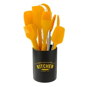 8-piece yellow silicone baking tool set with a stylish black storage tube holder.