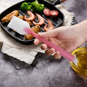 Handheld pink translucent silicone basting brush for professional BBQ and kitchen cooking