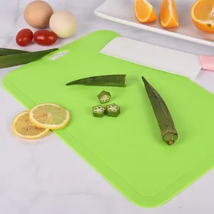 Large bright green plastic cutting board ideal for baby food supplement and fruit preparation