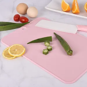 Non-slip pink PP plastic cutting board for fruit and vegetables in modern kitchen