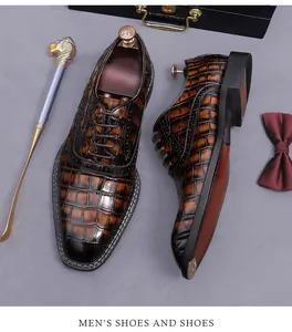 Detailed view of brown crocodile pattern men's Oxford shoes with elegant brogue accents