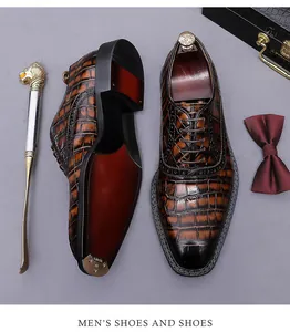 Premium brown men's crocodile pattern leather oxford shoes showing detailed sole and texture