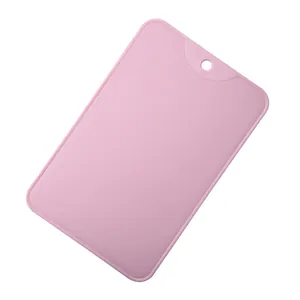 Durable pink non-slip PP plastic cutting board for fruit and small kitchen tasks.
