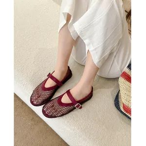 Elegant burgundy mesh Mary Jane flats with sparkling rhinestones and a buckle strap.