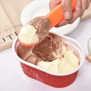 Bright orange PP plastic ice cream scoop digging chocolate and vanilla frozen treats