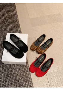 Overhead view of French vintage round toe Mary Jane ballet flats in black, red and leopard