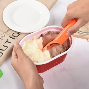 Ergonomic orange plastic ice cream scoop for effortless fruit and dessert ball making