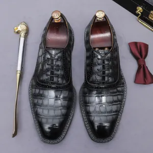 Elegant men's croc-embossed black leather Oxford shoes for business or formal wear.