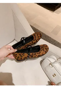 Detailed view of leopard print Mary Jane flats with retro round toe and buckle strap