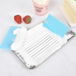 Blue plastic cake cream scraper set with serrated and smooth edges for baking decorating.