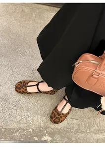 Close-up view of stylish leopard print round toe Mary Jane ballet flats with strap detail