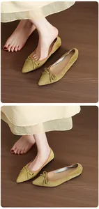 Close-up view of French vintage pointed toe ballet flats with elegant bow detail