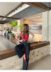 Elegant red retro Mary Jane flats with single strap, French ballet style, cafe outdoor shot