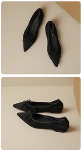 Detailed view of black pointed-toe ballet flats with bow tie detail and suede texture