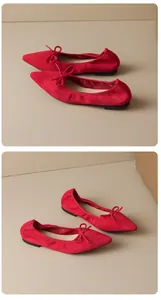 Elegant red pointed-toe ballet flats with bow detail shown from two different side angles