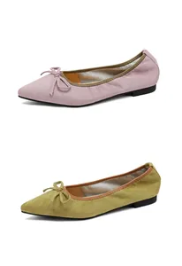 Classic pointed-toe ballet flats with decorative bows in soft pink and olive green suede