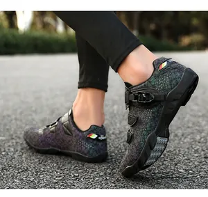 Detail of men's professional mountain cycling shoes with buckled straps on asphalt road