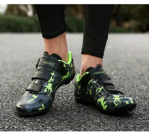 Action shot of men's mountain bike cycling shoes with green camo print