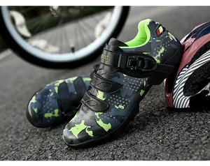 Detail view of camouflage MTB cycling shoes with quick-adjust buckle and green lining