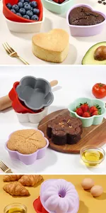 Detail view of multi-shape food-grade silicone cake molds for baking heart and flower cakes.