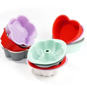 Colorful heart and flower-shaped food-grade silicone cake molds for baking and mousse.