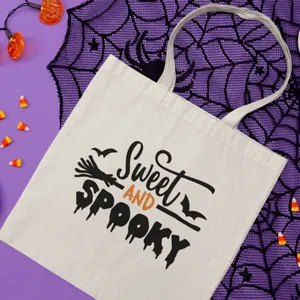 Festive white canvas tote bag with 'Sweet and Spooky' Halloween themed graphic print