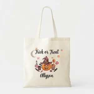 Detailed view of Halloween pumpkin and 'Trick or Treat' print on white canvas tote bag