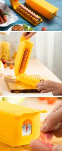 Close-up of a multifunctional yellow hot dog slicer showing the sharp metal cutting blade