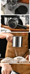 Action shot of flour sifting onto bread dough using a stainless steel sifter