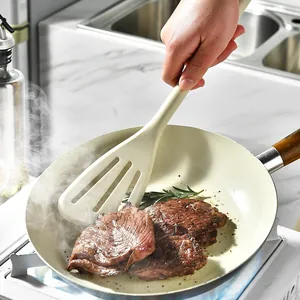 Spatule à fente en silicone résistant à la chaleur pour faire frire un steak à la poêle
