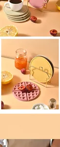 Close-up of double-sided silicone heat insulation mats with a waffle pattern.