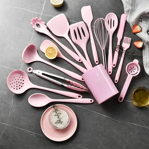 Comprehensive pink silicone kitchen utensil set with storage holder for non-stick cooking.