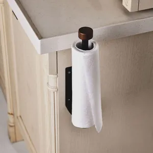 Wall-mounted black metal paper towel holder with wooden top cap for kitchen cabinets