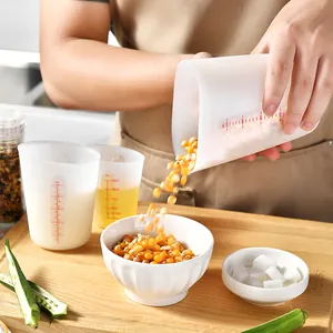 Heat resistant silicone measuring cup set with clear scale markings for kitchen baking